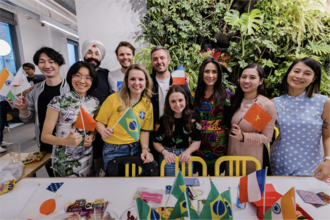 A group of people holding different country flags